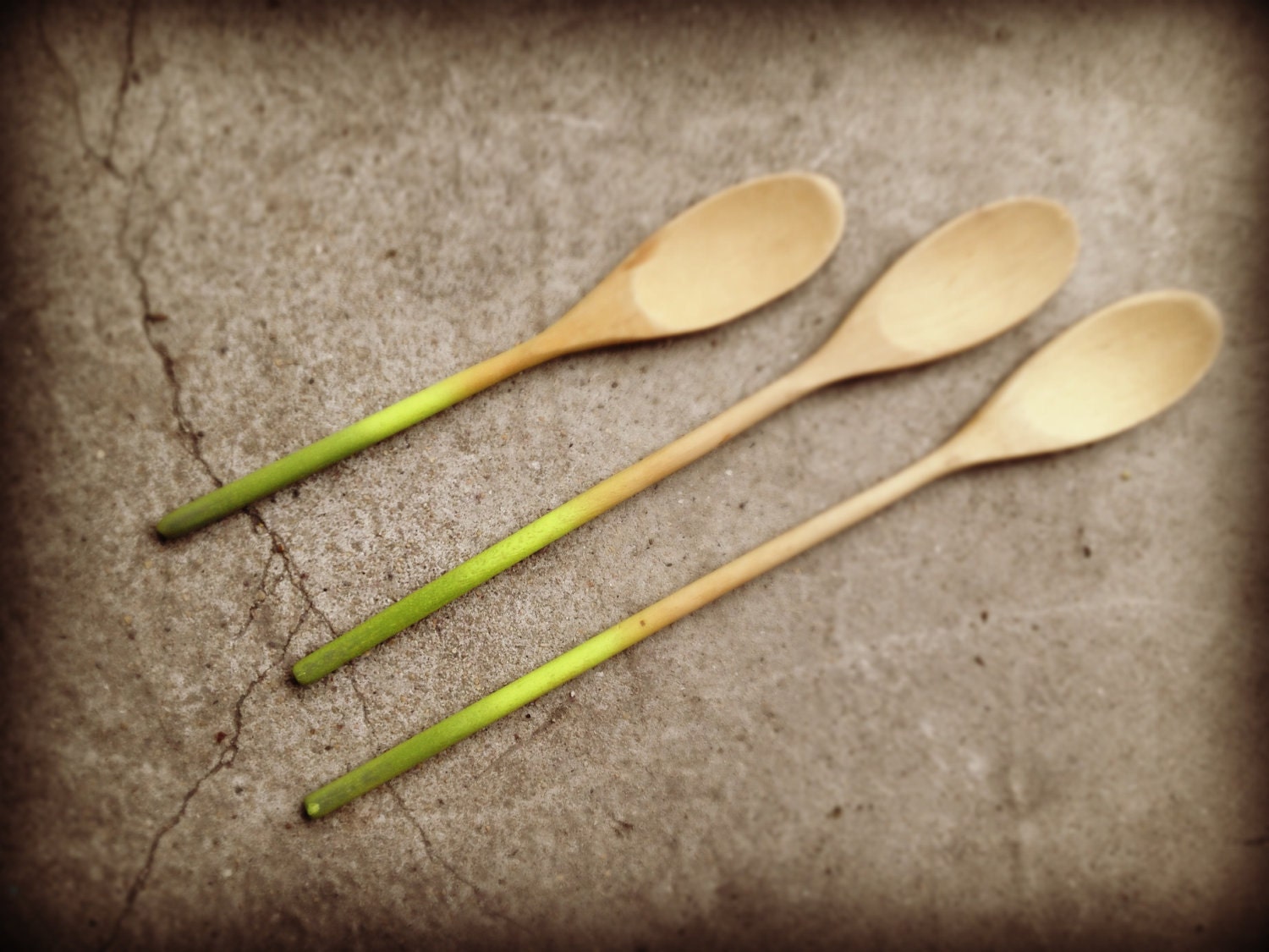 Set of four green ombre wooden spoons