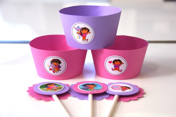 Dora+Cupcake+Holders ... similar to 24 Dora the Explorer Cupcake Toppers and Wrappers on Etsy