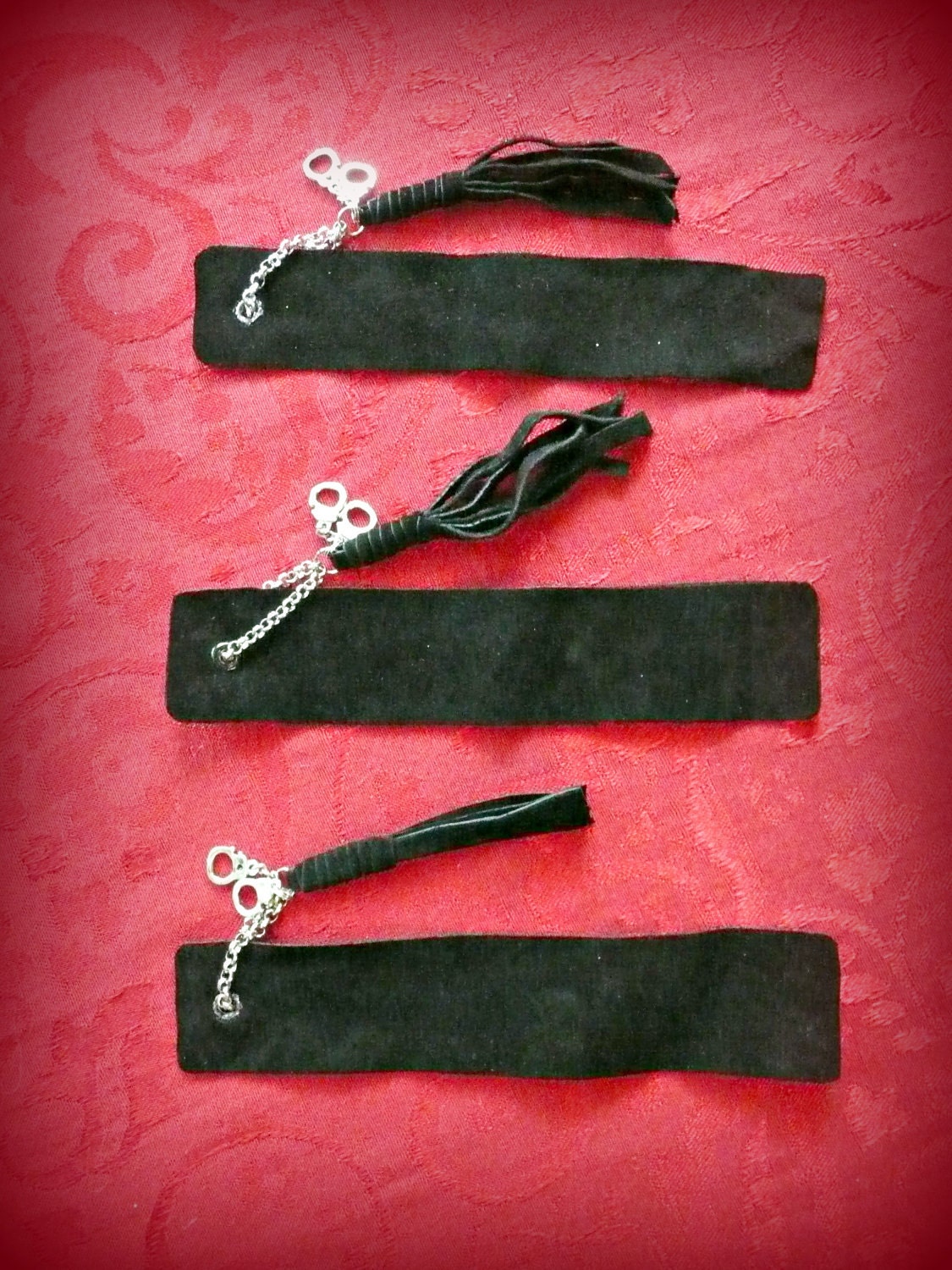 Fifty Shades of Grey inspired handmade leather Bookmark with leather flogger and silver tone handcuff charm.