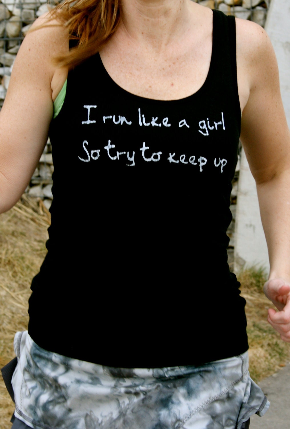 I run like a girl so try to keep up done in vintage looking silk screen on a black workout tank top with a plain back