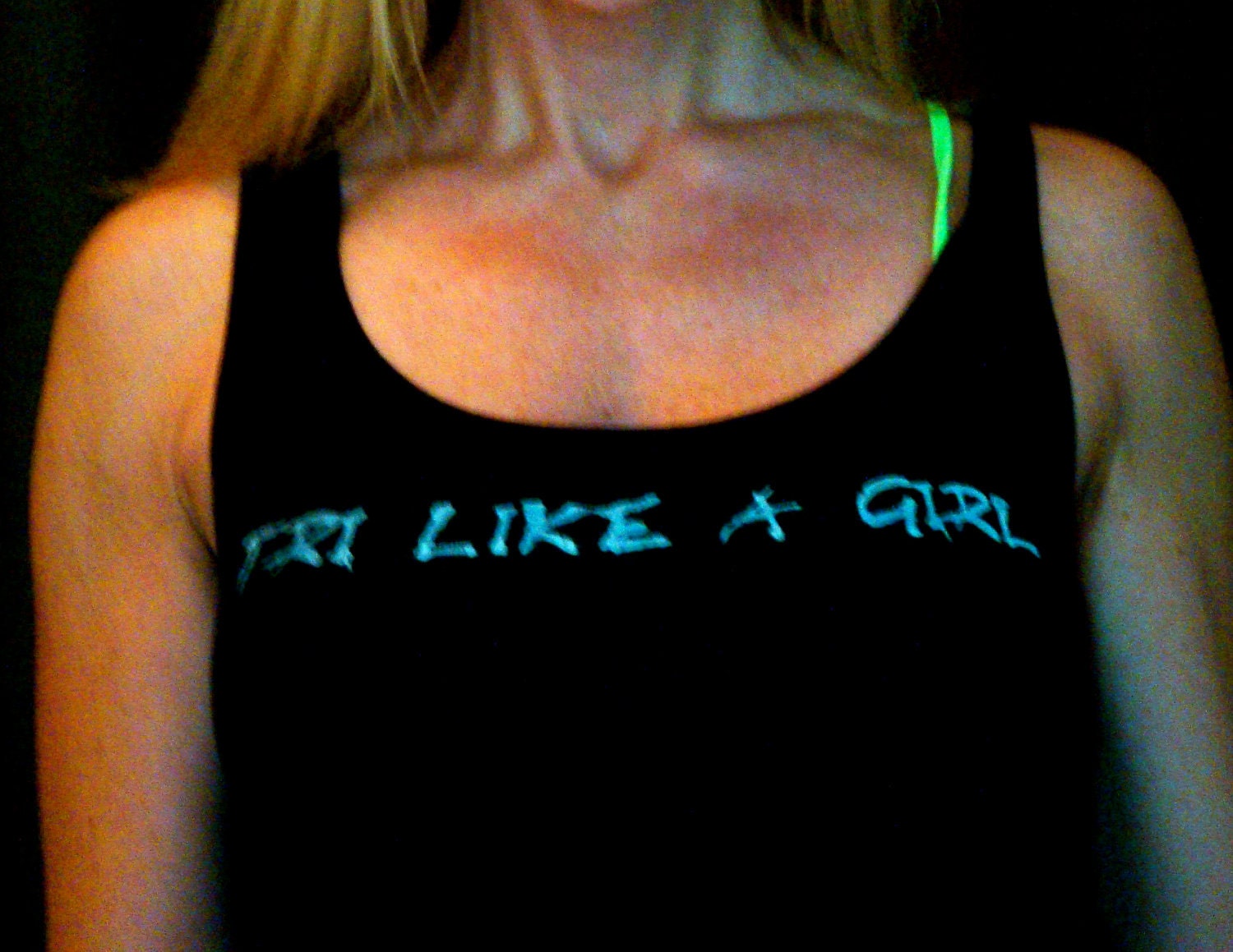 Tri like a Girl triathlon done in vintage looking silk screen on a black workout tank top with a plain back