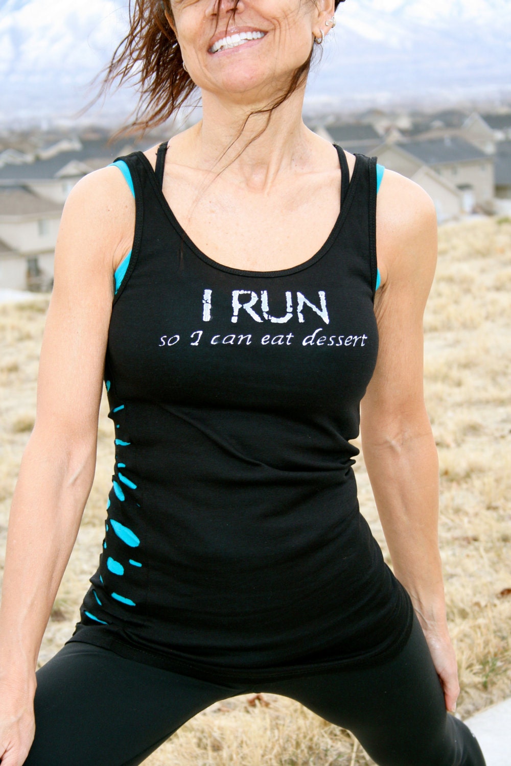 I RUN so I can eat dessert done in vintage looking silk screen on a black workout tank top with a random hole back