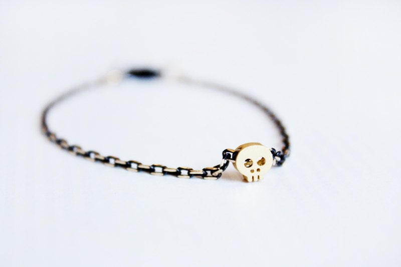 tiny skull bracelet - matt 14kt gold plated skull on BLACK chain