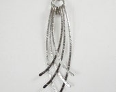 Sterling silver crossed hammered wire pendant