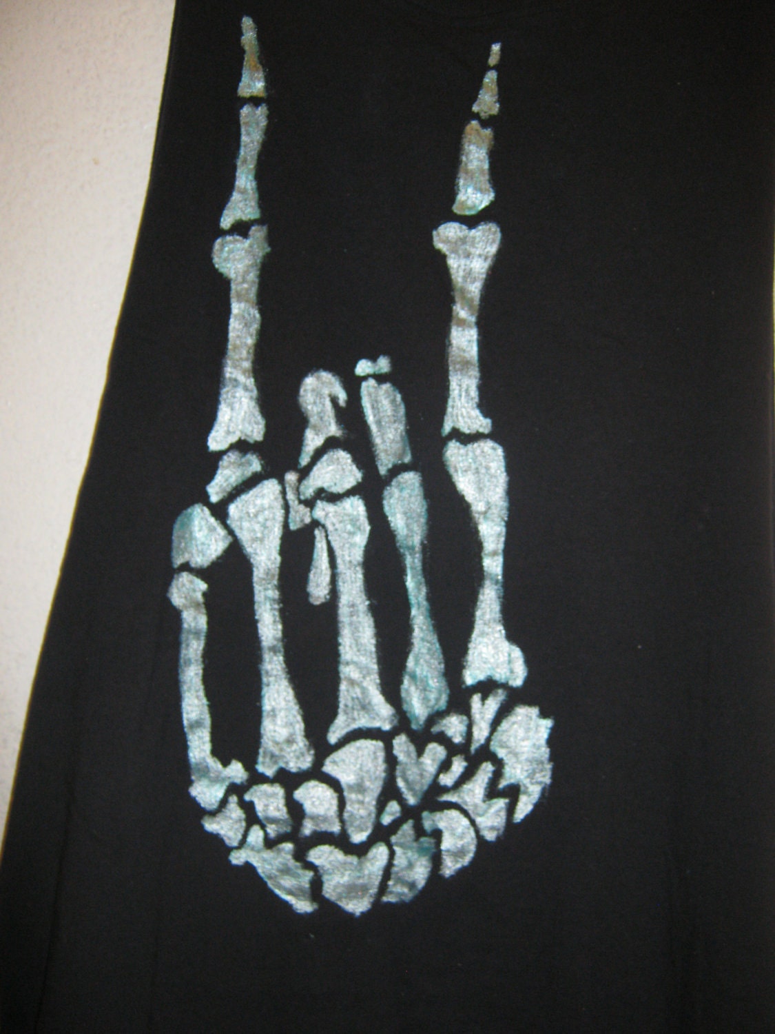 Sleeveless black skeletal hand tee