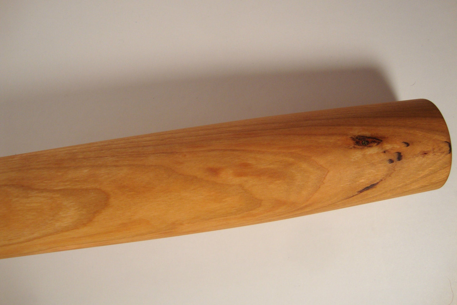 Very large cherry rolling pin, twenty two inches long, two inches thick