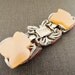 1960s lucite large leaf orange bracelet. SMOLDERING HUES.