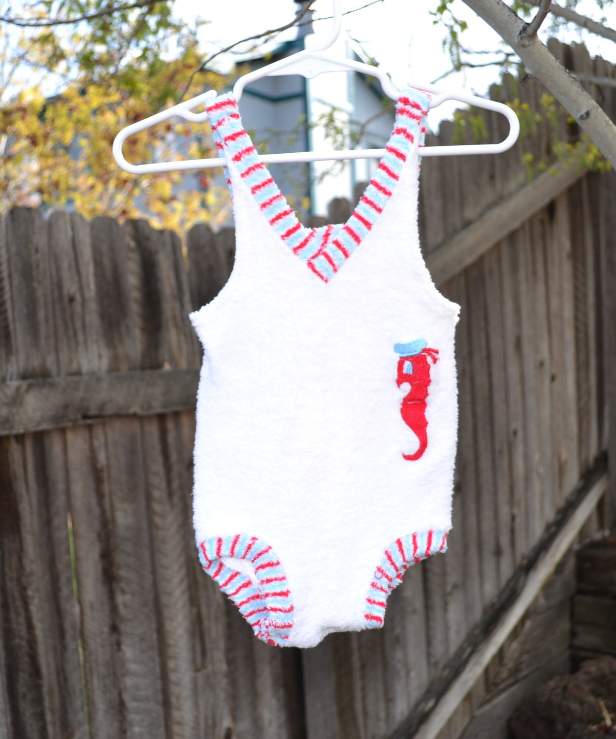 Vintage infant/ toddler girls swimsuit/ bathing suit/ swimwear white with light blue, red, and white neckline and leg detail with seahorse