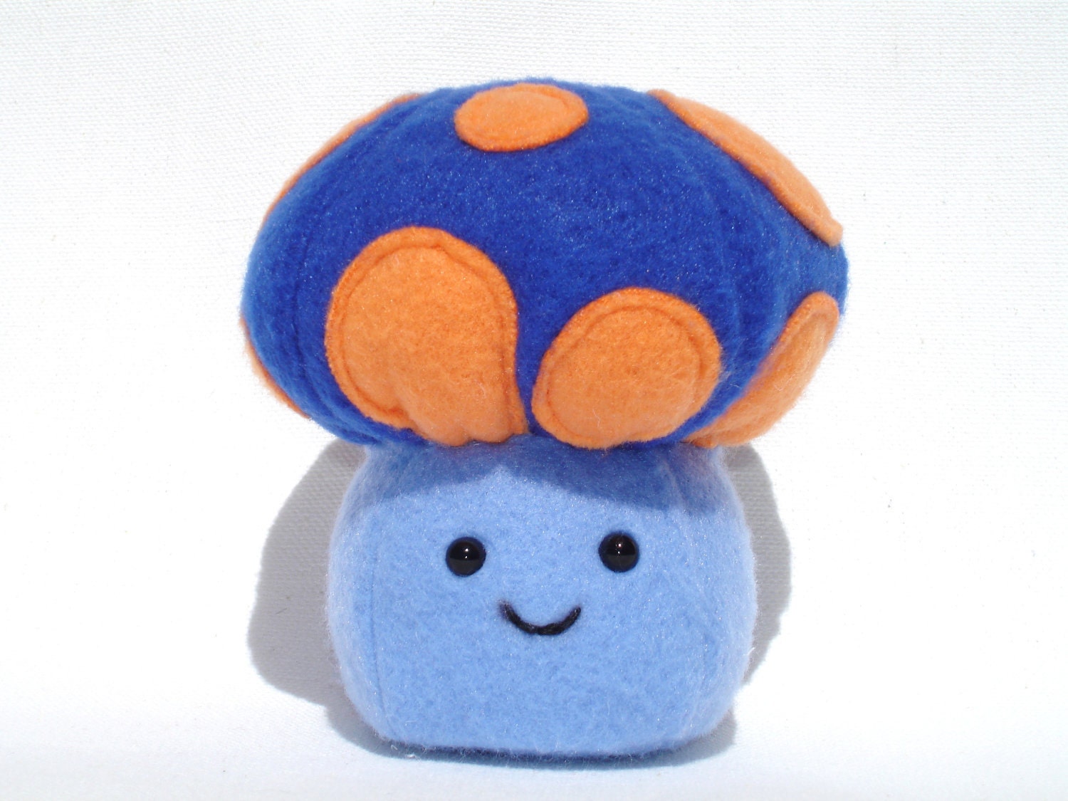 Plush mushroom toy made with blue and orange fleece, made to order