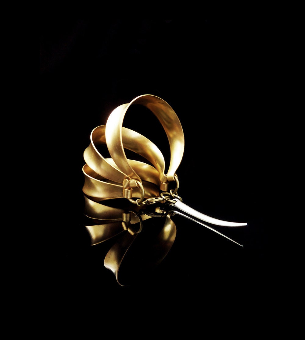 Three dimensional , vintage ,gold tone , brass rings  cuff bracelet