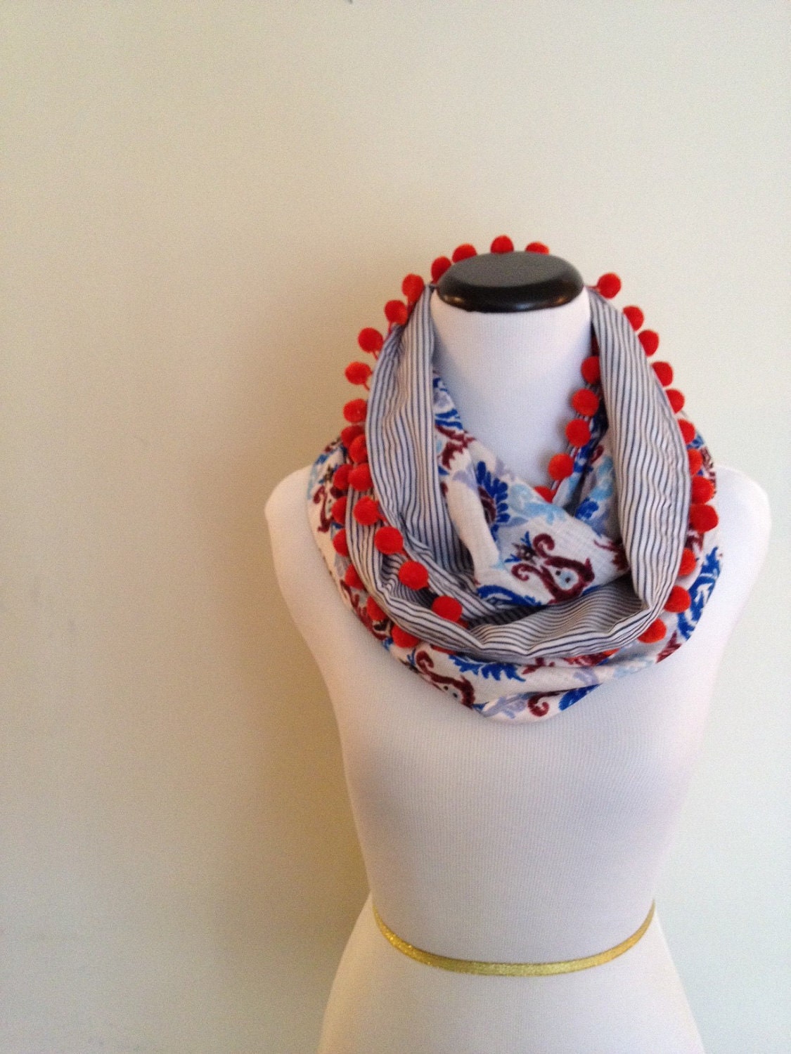 Infinity Circle Scarf with pom pom accents.