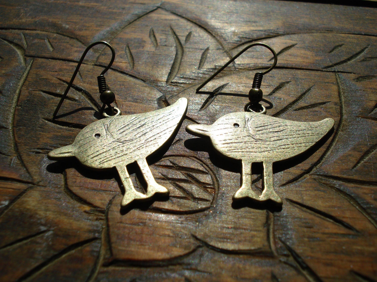 Antiqued gold tone bird earrings