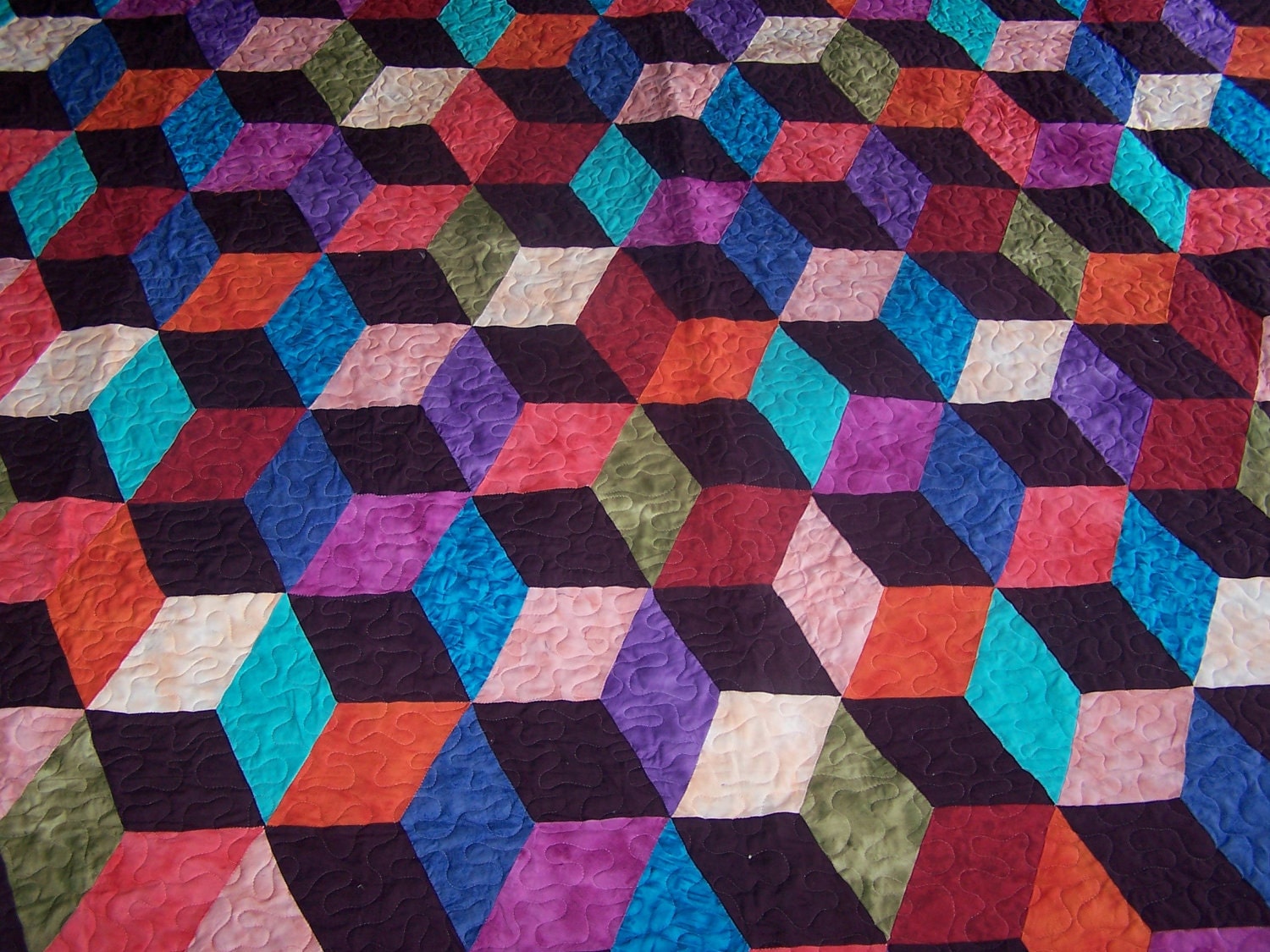 EXTRODINARY, Hand-made tumble block quilt.