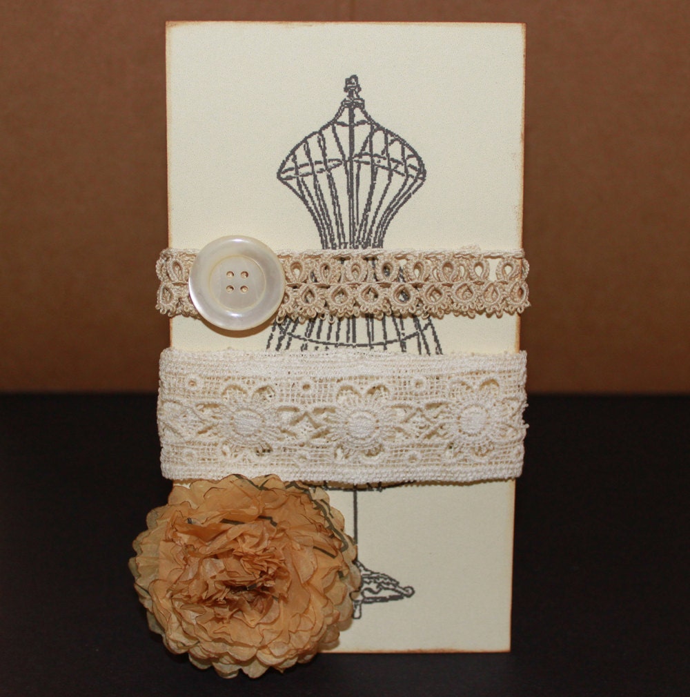 Antique lace vintage button with pattern tissue flower on vintage dress form tag