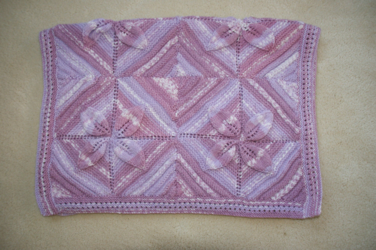 Items similar to Hand knitted baby leaf square blanket in pink mix on Etsy
