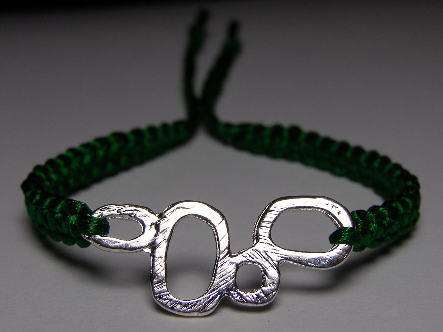 Green satin bracelet with silvery finding