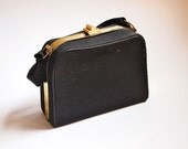 1950's black bengaline evening bag with little handle and cute cloud shaped gold clasp.