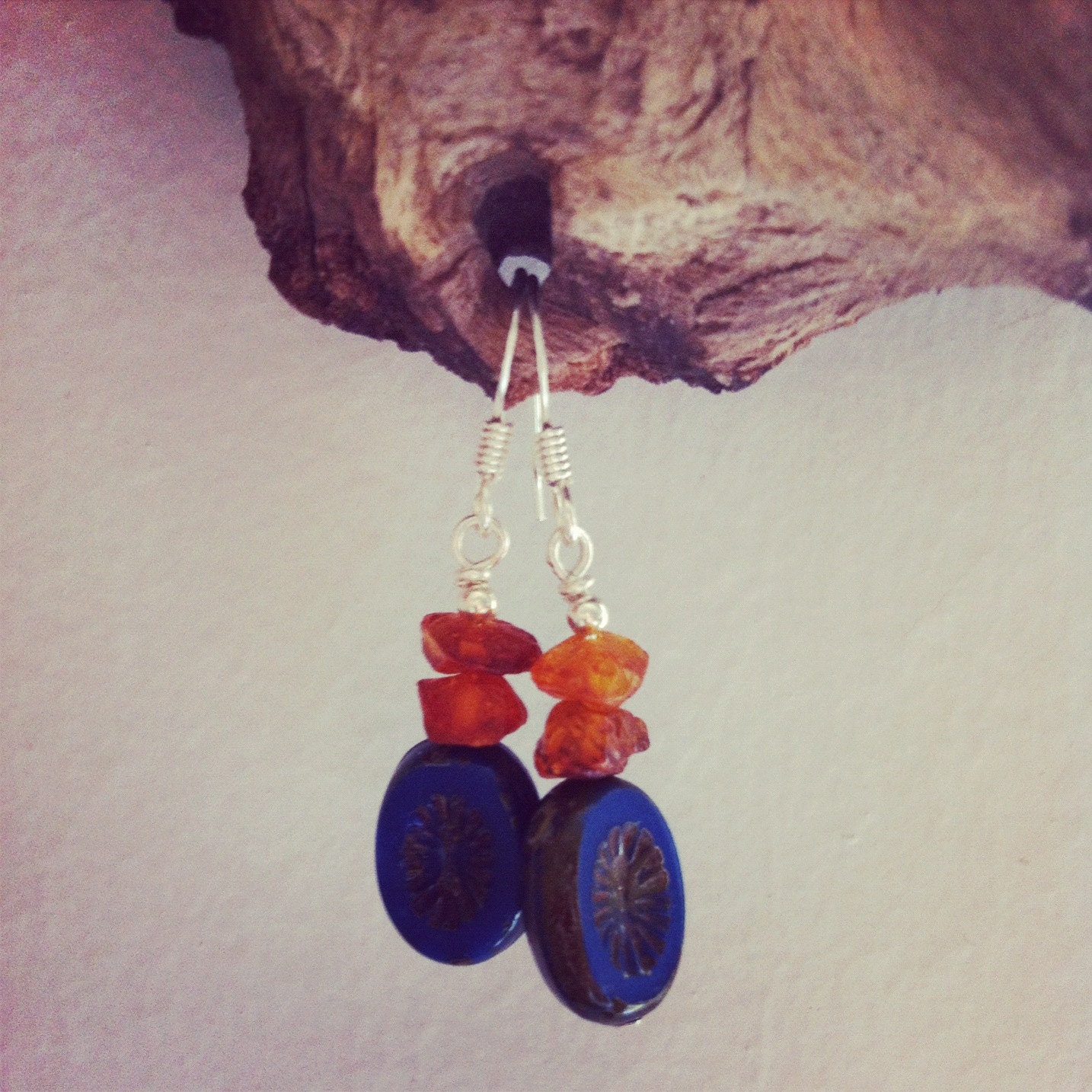 small earrings with dangling raw (unpolished)  amber and czech glass beads oval starburst opaque blue