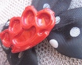 RED BRASS KNUCKLES hair bow, black and white polka dots
