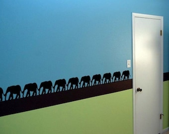Line of  10 Elephants Holding their Tails