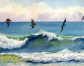 Riding the Crest pelicans just above an ocean wave