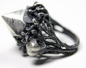 nesting in the underworld. cast crystal and hummingbird skull ring.