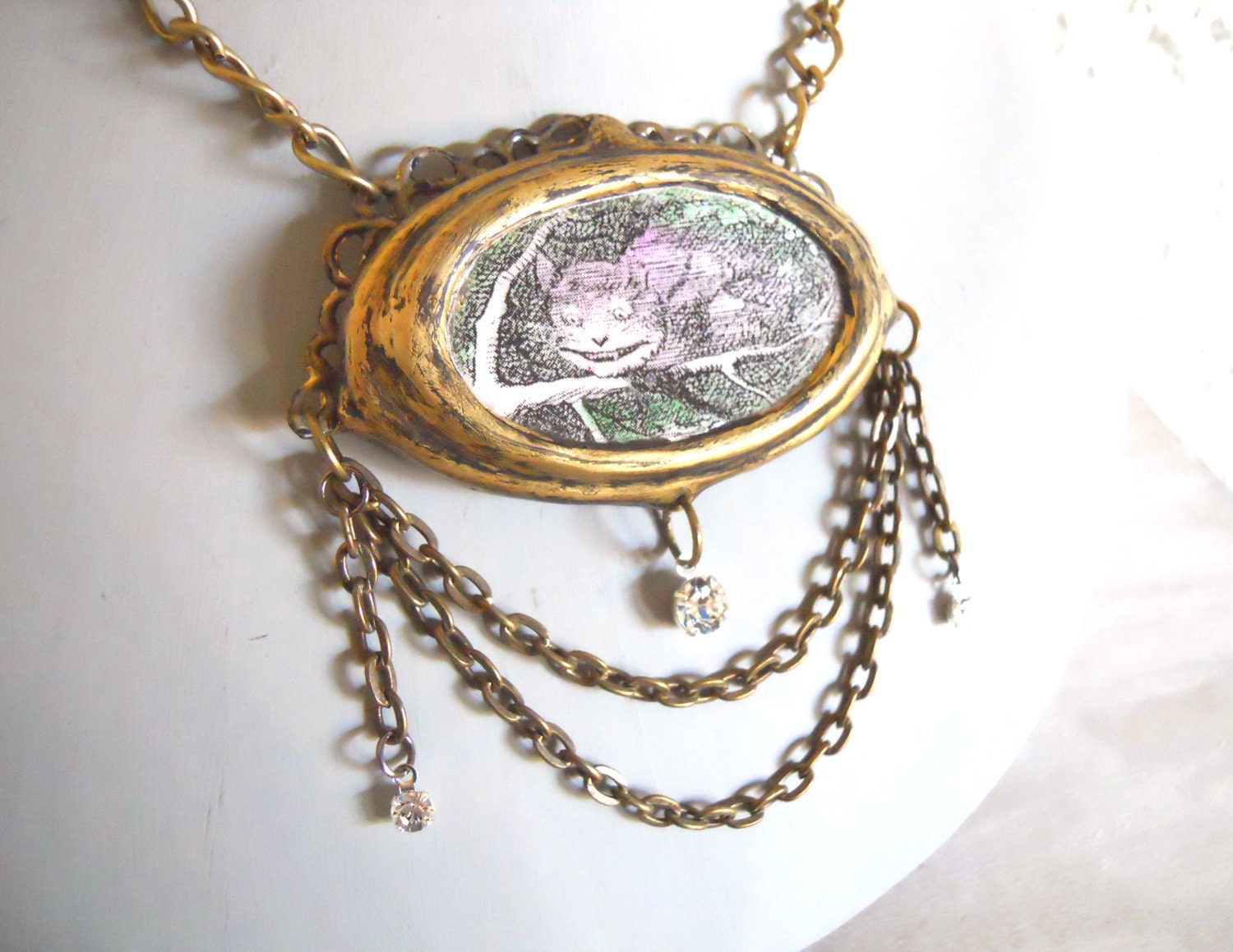 Cheshire Cat Necklace Tea Party Jewelry Alice in Wonderland Character in an Ornate frame Setting with Chains and Crystals