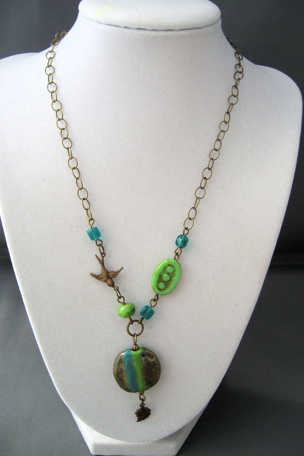 Kazuri Bead Necklace Lime Green and Teal Stripes with Brass Bird