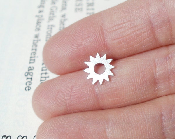 sunny lapel pin in sterling silver, handmade in England by Huiyi Tan