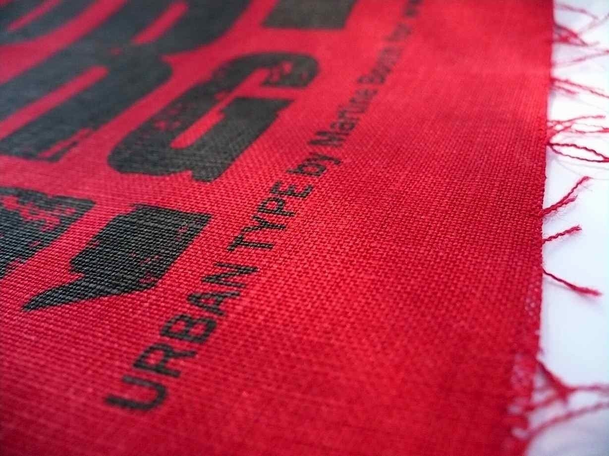 screen printed fabric black on red linen typography, letters, type design