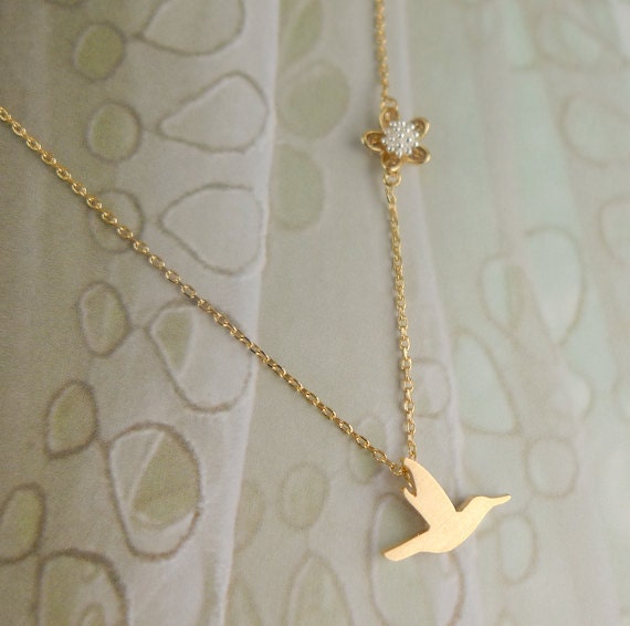 gold bird necklace with flower charm