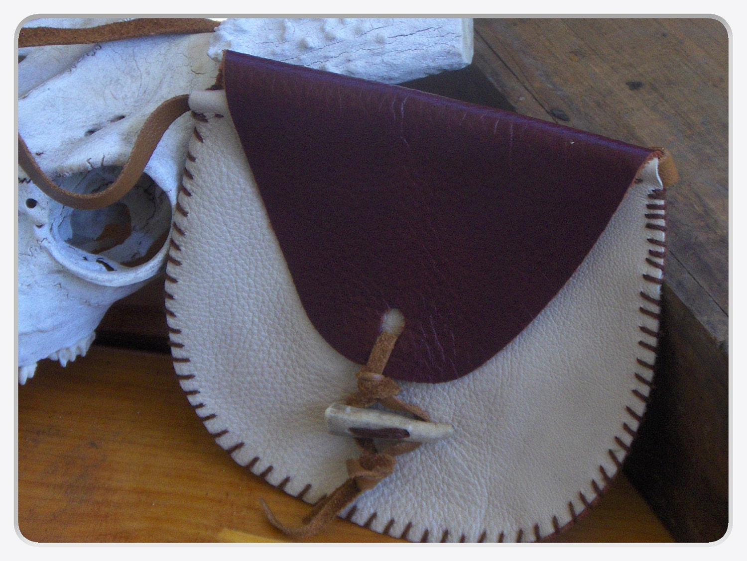 Dyani Lequoia. Burgundy & Almond Leather Medicine purse, Deer Antler Tip Toggle buckskin strap. Handmade by Chymiera