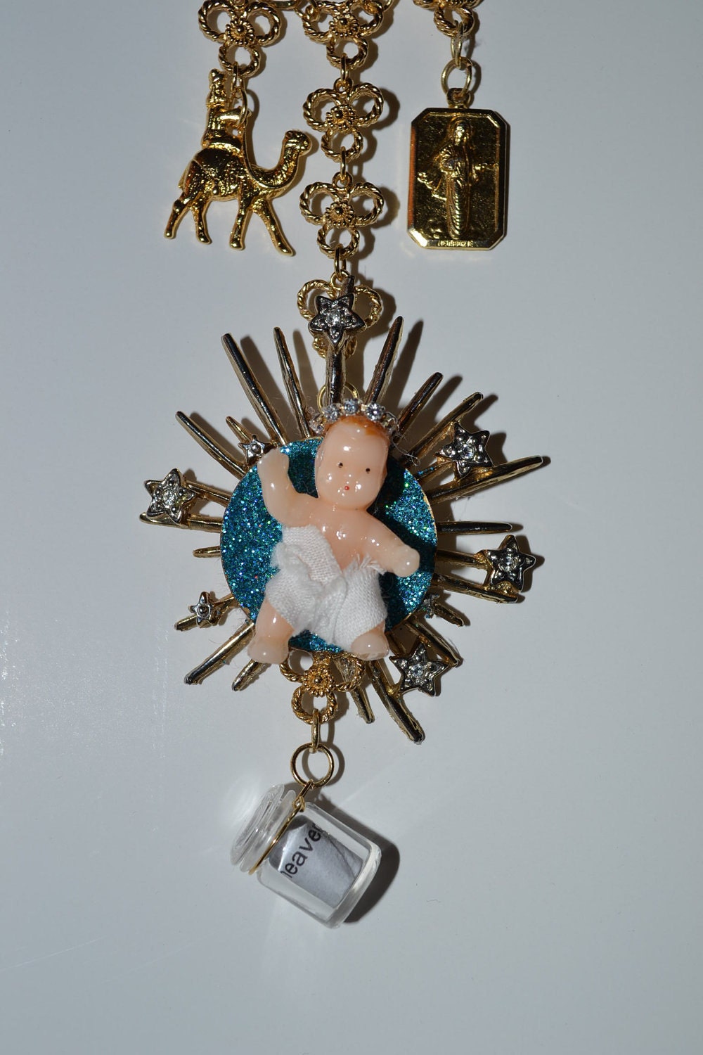 Baby Jesus Upcycled Brooch Charm Assemblage Necklace with Tiny Bottle Locket, Winter Blessing