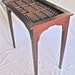 Arts and Crafts style display table with a drawer