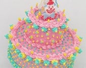 Faux Cake Clown Sculpture with Pink and Blue Icing