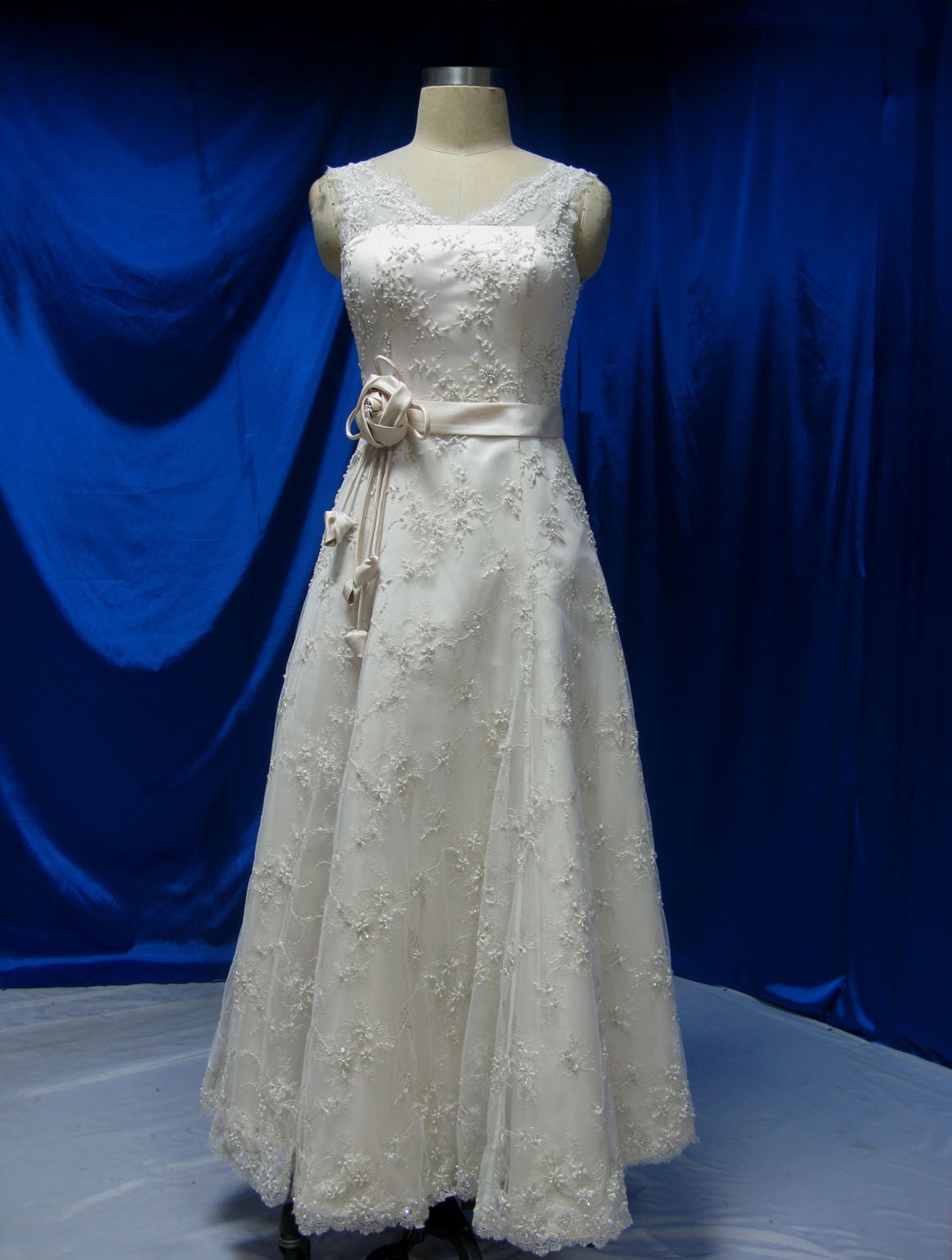 Vintage Inspired Wedding Dress with Floral Lace and Sash