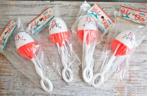 Ratlles for Baby Vintage egg shape celluloid 1960s red and white with pink flower original package
