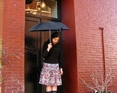 Women's skirt with cheetah print yoke. Red, grey, black flannel print embellished with braid and flowers.