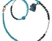 Animal totem beaded necklace, hematite. Turquoise raccoon pendant necklace