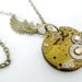 Steampunk Necklace, vintage watch movement with angel wing and swarovski - Timeless Relic