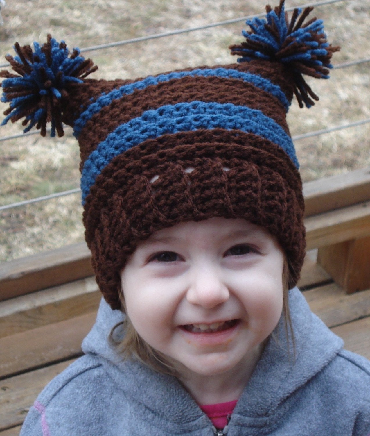 Spunky childs crocheted pom pom beanie