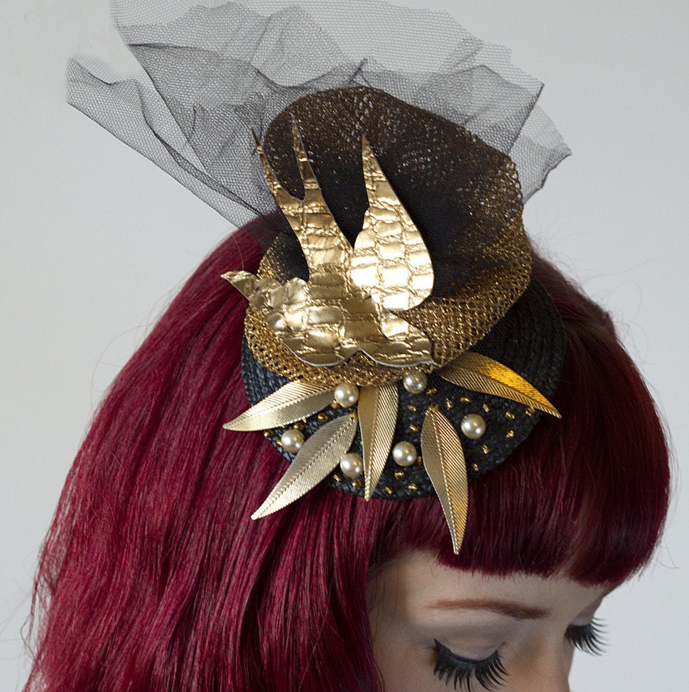 Gold and black cocktail hat