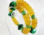 Vintage Beaded Bracelet, Green Givre Glass Disk Beads, Amber Yellow Plastic Flowers, Coiled Wire Wrap Cuff, Summer Fall, 1970s Jewelry