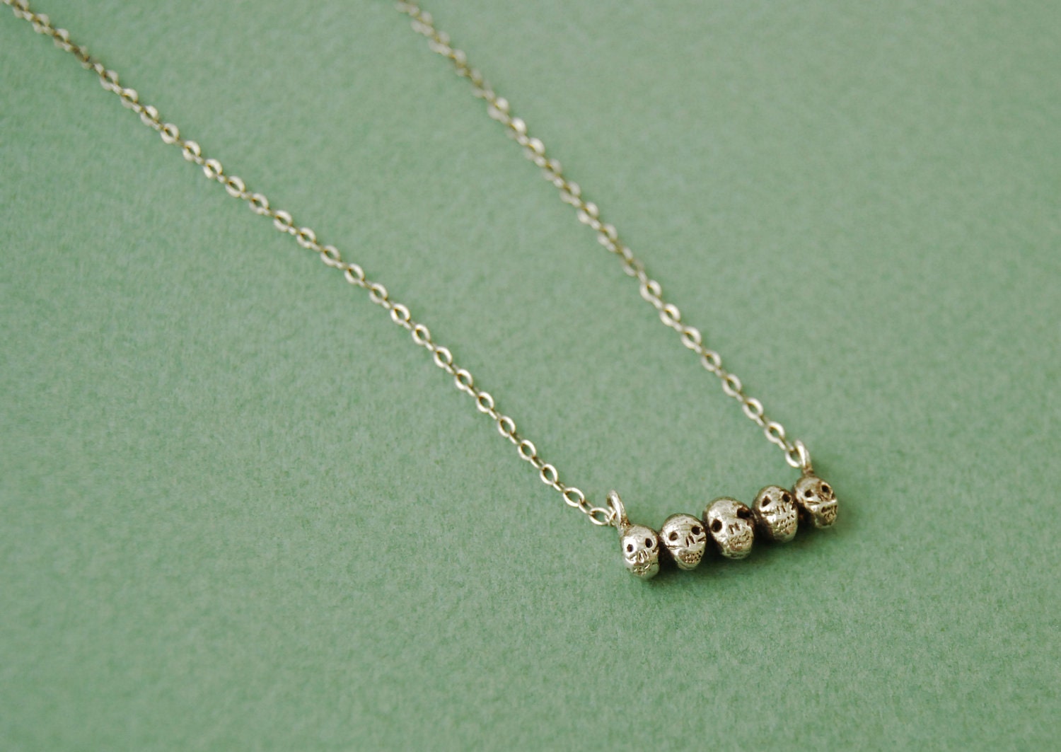Tiny sterling silver skull necklace