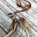 pretty natural brown feathers and braided leather headband