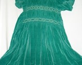 Girl's green velvet dress with smocking