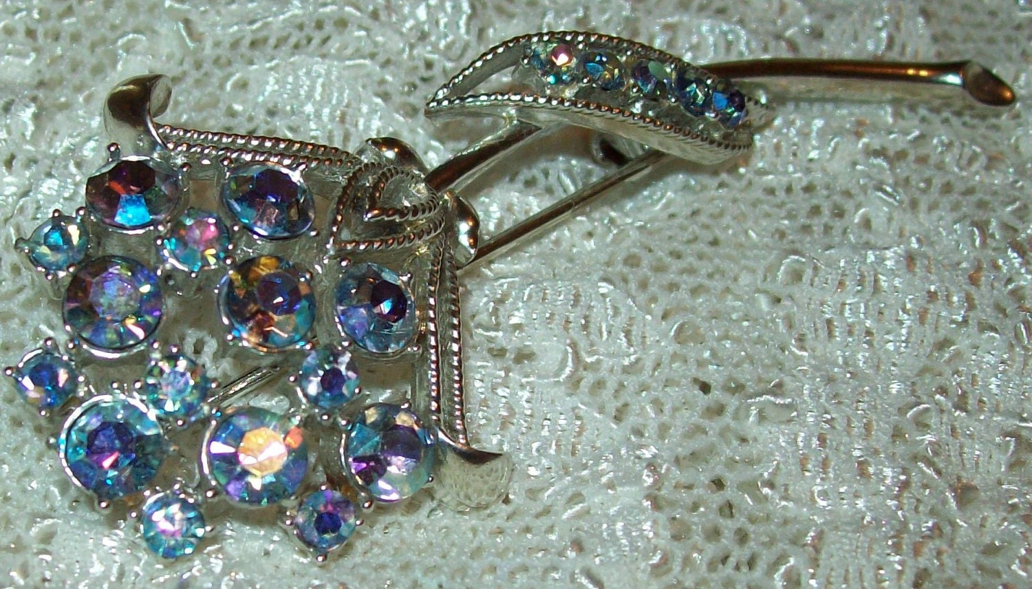 CORO signed flower brooch: aurora borealis blue rs floral figural pin
