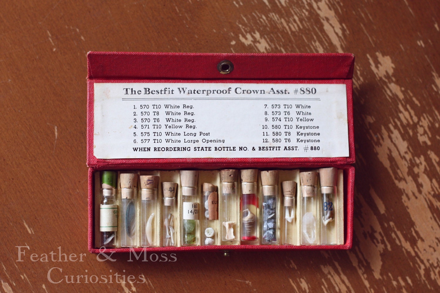 Miniature curiosities in vintage vials with leather case.