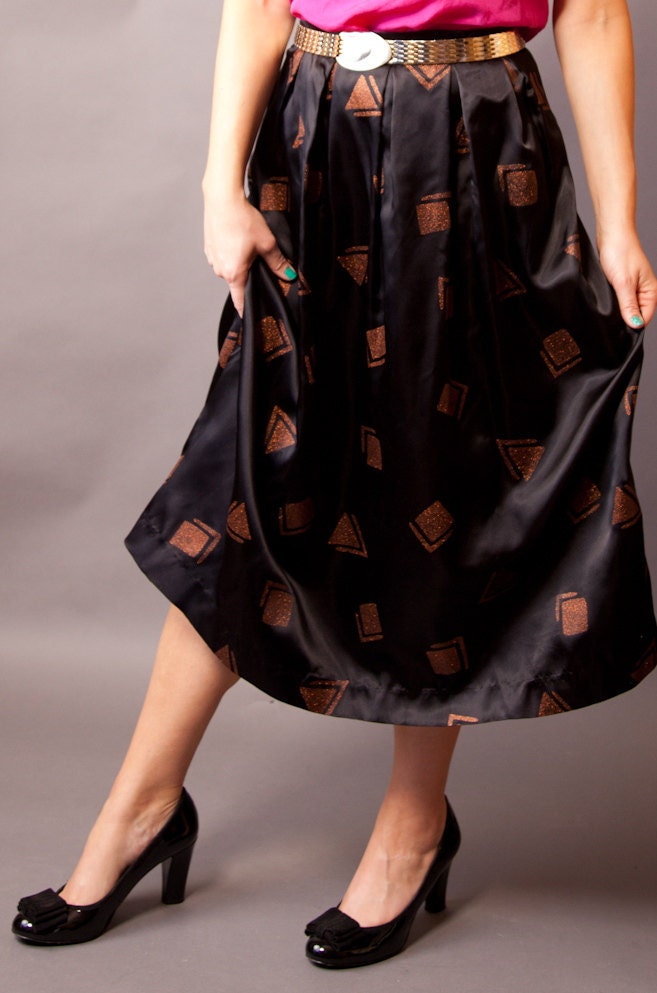 1960s black silky party skirt by Career Guild. Medium