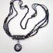 Rainbow tribal pewter necklace - Antiqued pewter focal, black ab and brown iris beads, multistrand, pendant circles:Black Rainbow